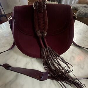 Altuzarra Burgundy Suede Saddle Crossbody with Braided Tassel